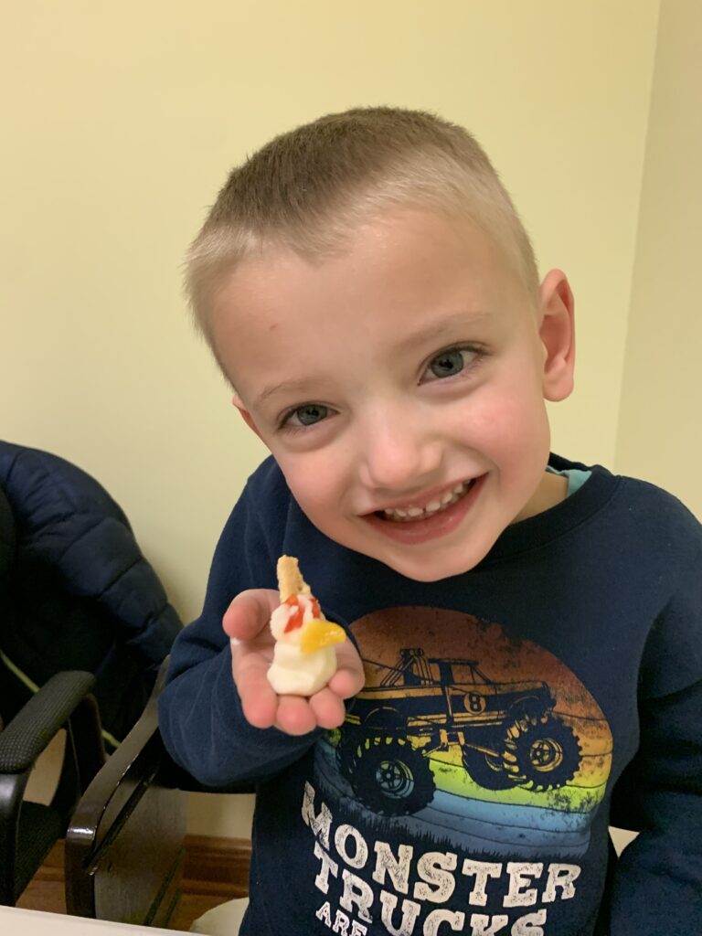 Keeping-warm-in-feeding-therapy-Exploring-food-and-made-a-snowman-768x1024