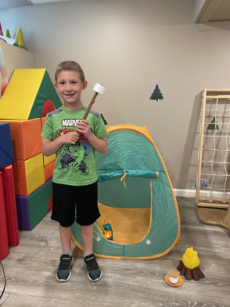 Kid-with-smore-on-stick-768x1024