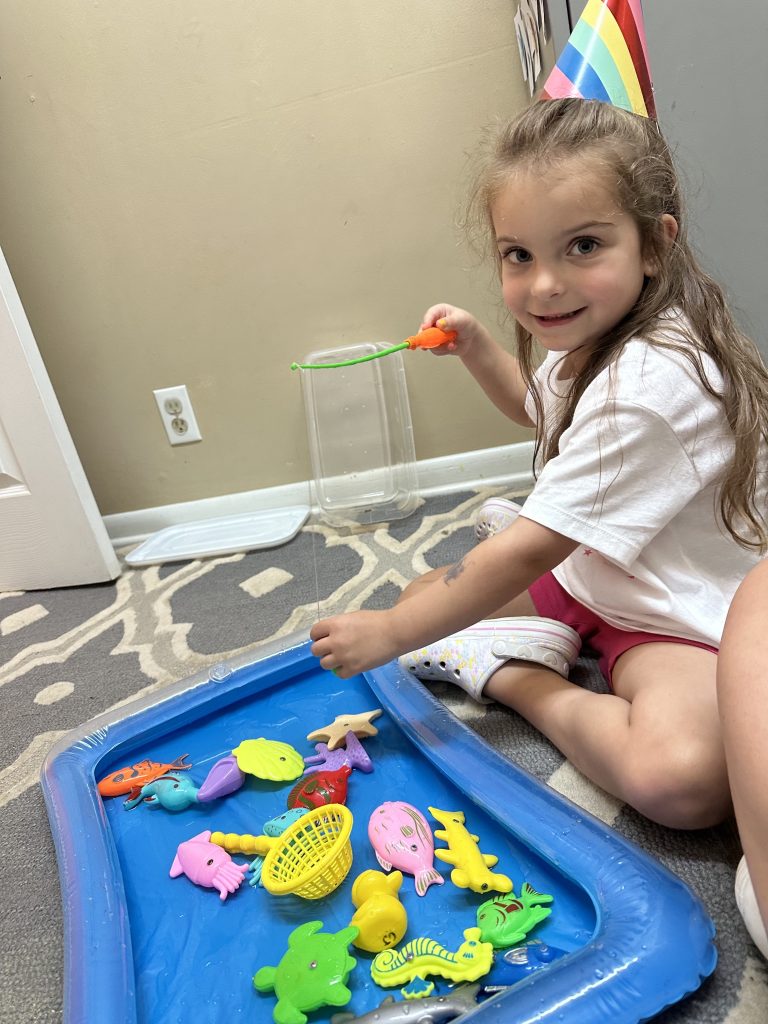 Kiddo-w-fish-pond-768x1024